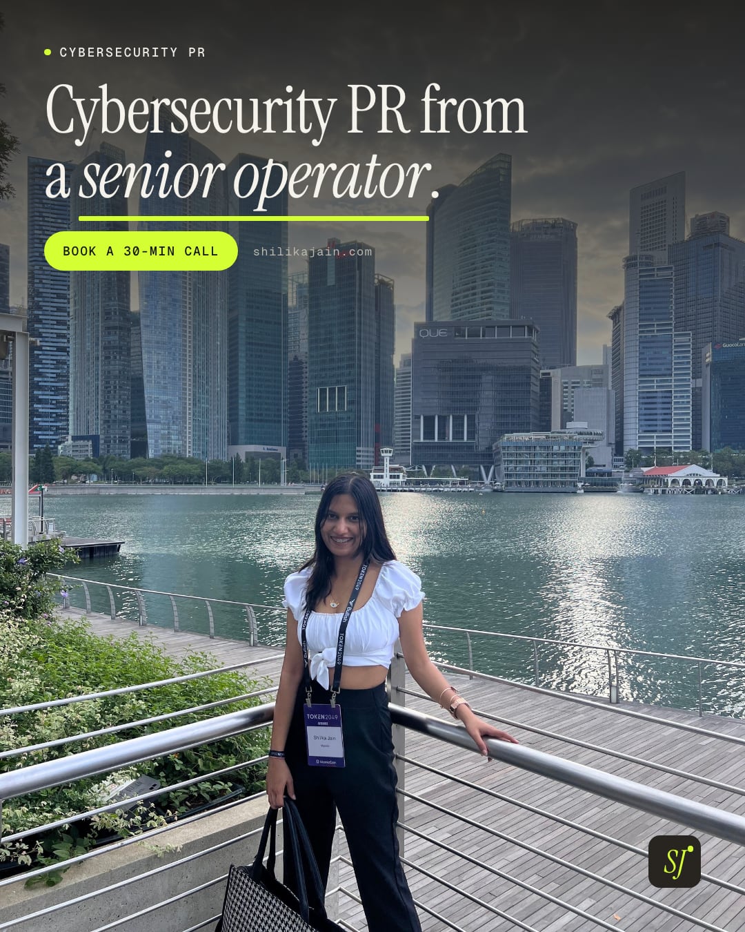 Cybersecurity PR from a senior operator. Photo: Shilika Jain leaning on the Marina Bay railing with the Singapore skyline across the water.