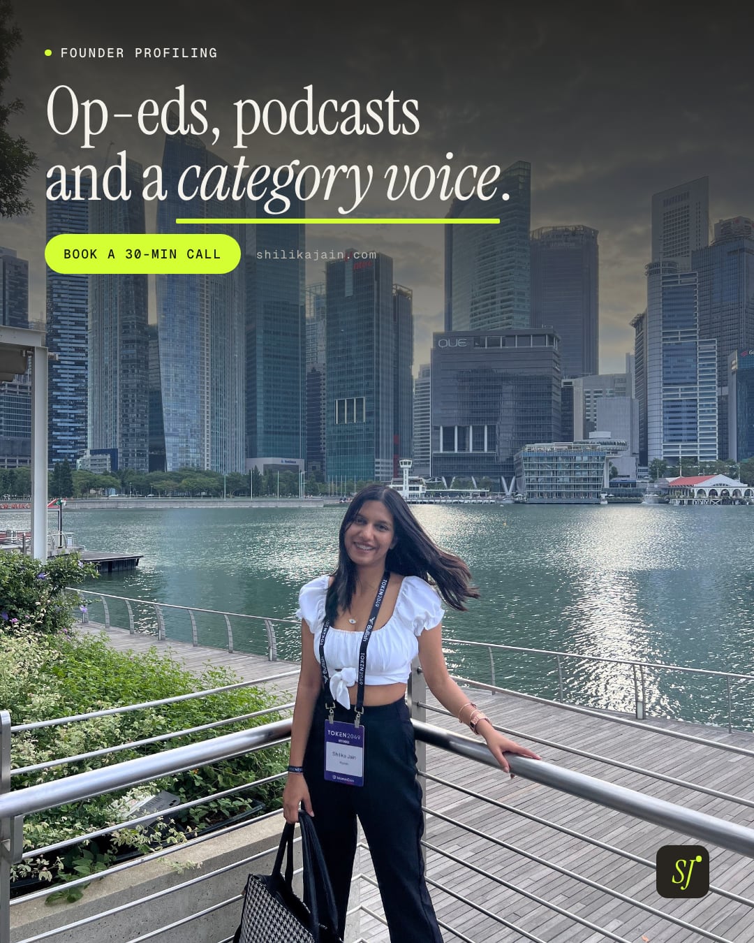Op-eds, podcasts and a category voice. Photo: Shilika Jain at the Marina Bay railing with the Singapore financial district skyline behind her.