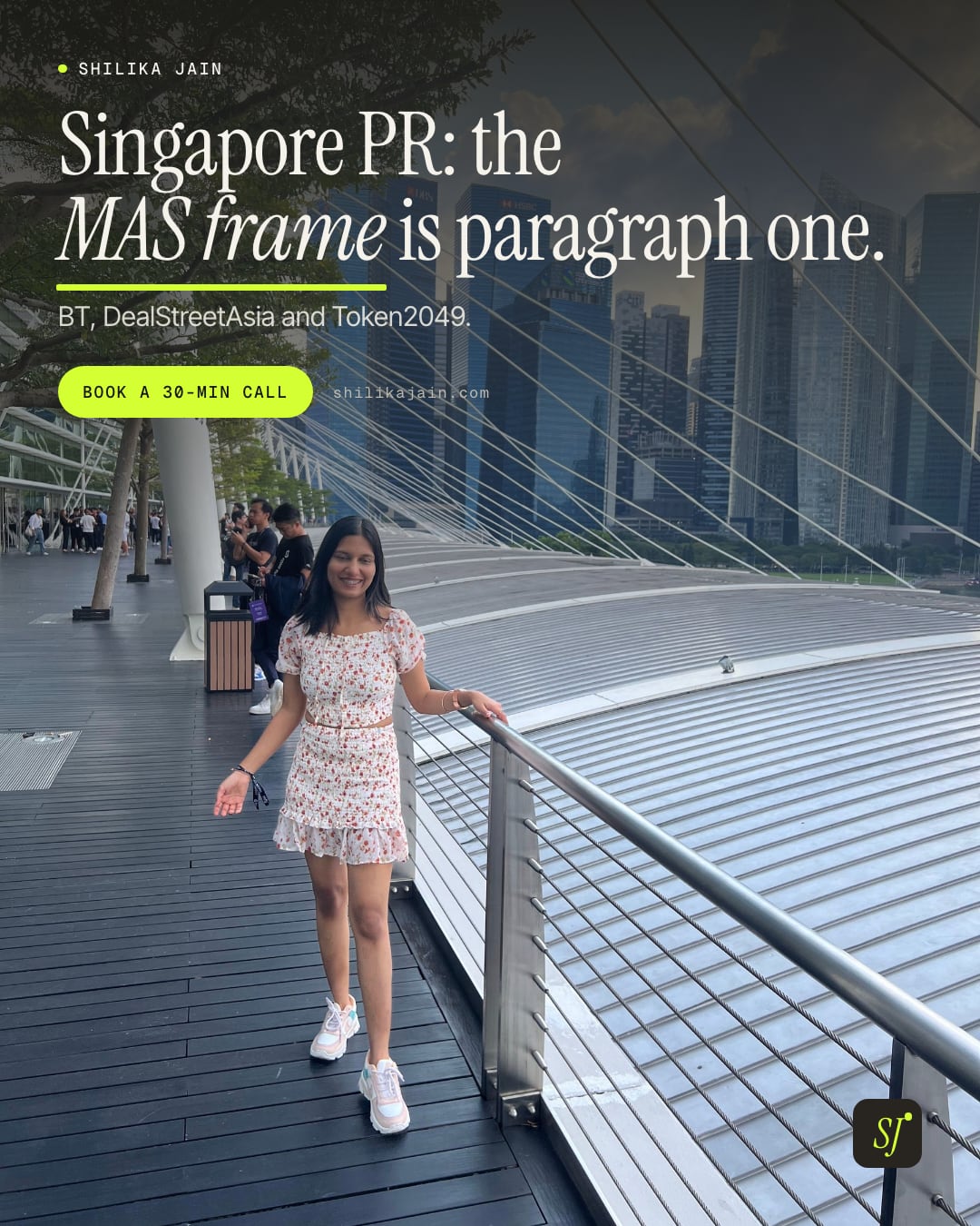Singapore PR: the MAS frame is paragraph one. BT, DealStreetAsia and Token2049. Photo: Shilika Jain in a floral dress on a Marina Bay footbridge with the Singapore skyline behind her.