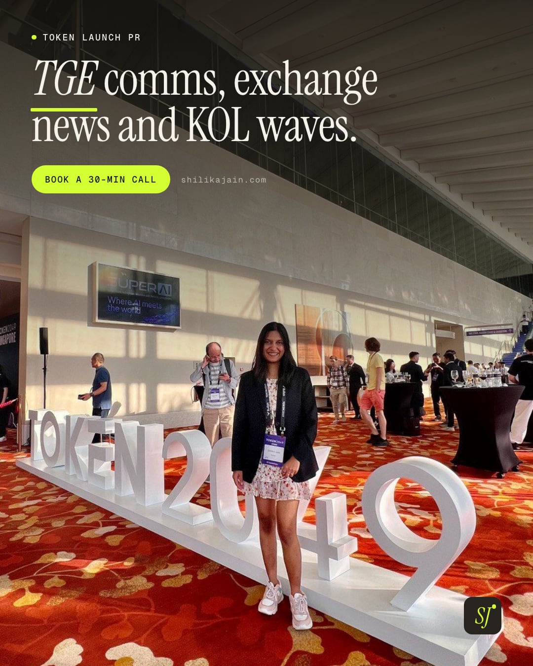 TGE comms, exchange news and KOL waves. Photo: Shilika Jain in a black blazer beside the TOKEN2049 Singapore sign in the conference hall.